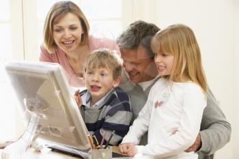 Royalty Free Photo of a Family at the Computer