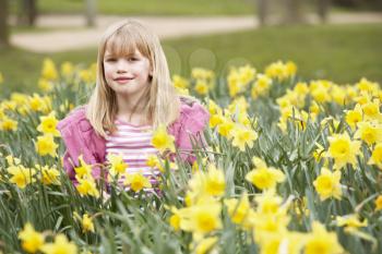 Royalty Free Photo of a Little Girl in Daffodils