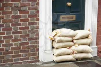 Royalty Free Photo of Sandbags Against a Door