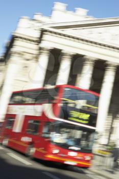 Royalty Free Photo of a Double Decker Bus Passing the Royal Exchange