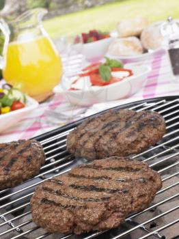 Royalty Free Photo of Burgers on a Barbecue