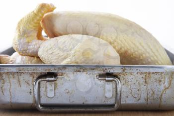 Royalty Free Photo of a Raw Chicken in a ROasting Pan