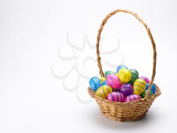 Royalty Free Photo of a Basket of Colourful Eggs