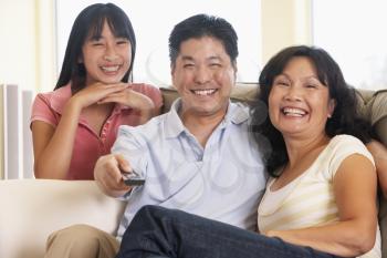 Royalty Free Photo of a Family Watching Television