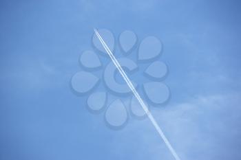 Royalty Free Photo of a Jet Tail in the Blue Sky