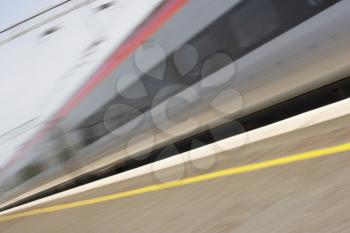Royalty Free Photo of a Train Passing a Platform