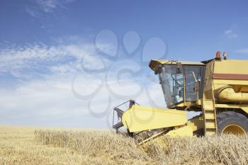 Royalty Free Photo of a Combine in Field