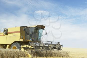 Royalty Free Photo of a Combine in a Field