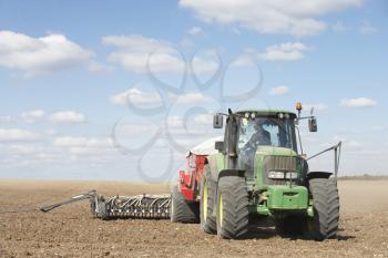 Royalty Free Photo of a Tractor Planting Seed