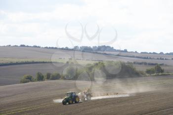 Royalty Free Photo of a Tractor Spraying