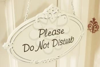 Royalty Free Photo of a Please Do Not Disturb Sign