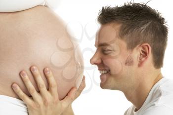 Royalty Free Photo of a Man Holding a Pregnant Woman's Belly