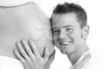 Royalty Free Photo of a Man Holding a Pregnant Woman's Belly