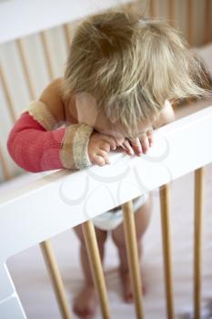 Royalty Free Photo of a Crying Toddler With Her Arm in a Cast