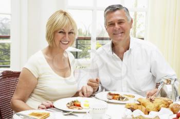 Royalty Free Photo of a Couple Having Breakfast at a Hotel