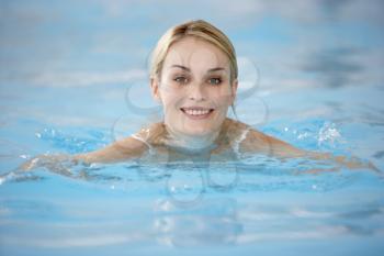 Royalty Free Photo of a Young Woman in a Pool
