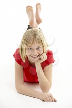 Royalty Free Photo of a Young Girl Lying on the Floor