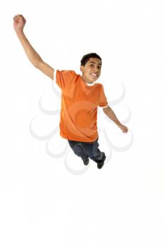 Young Boy Leaping In Studio