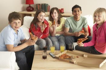 Royalty Free Photo of a Group of Kids Eating Pizza