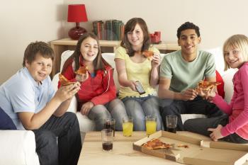 Royalty Free Photo of a Group of Children Eating Pizza