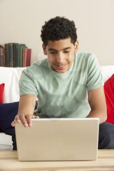 Royalty Free Photo of a Boy Using a Laptop