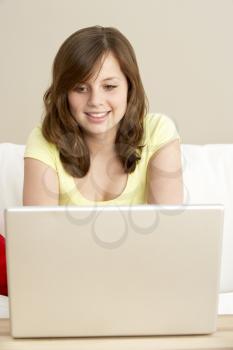 Royalty Free Photo of a Girl at Home With a Laptop
