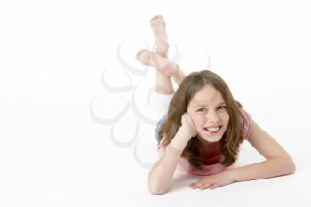 Royalty Free Photo of a Girl Lying on Her Stomach