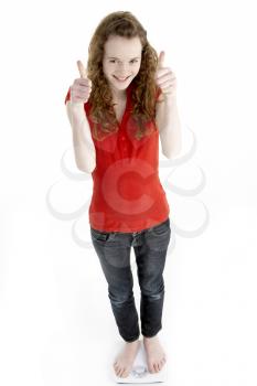 Royalty Free Photo of a Young Girl Giving Thumbs Up