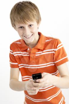 Royalty Free Photo of a Young Boy With a Cellphone