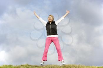 Royalty Free Photo of a Woman Jumping Outside