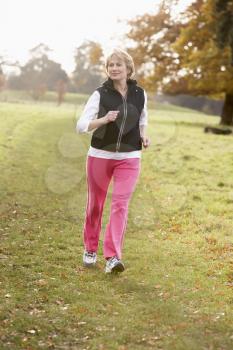 Royalty Free Photo of a Woman Jogging in the Park
