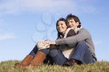 Royalty Free Photo of a Couple Sitting Outside
