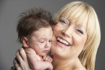 Royalty Free Photo of a Woman Holding a Baby