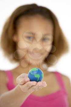 Royalty Free Photo of a Girl With a Small Globe in Her Hand