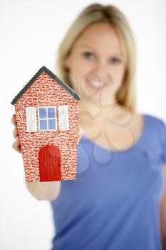 Royalty Free Photo of a Woman With a Small House