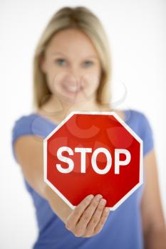 Royalty Free Photo of a Woman Holding a Stop Sign