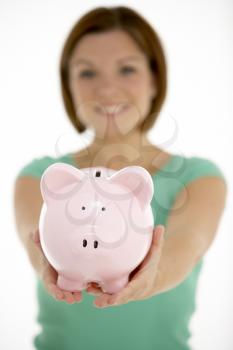 Royalty Free Photo of a Girl With a Piggybank