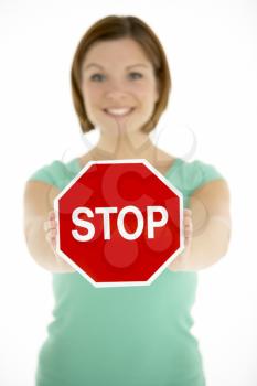 Royalty Free Photo of a Woman With a Stop Sign