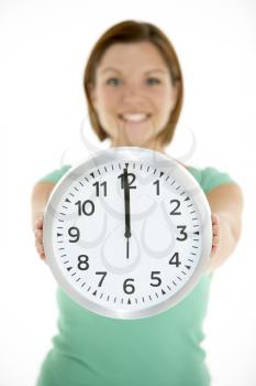Royalty Free Photo of a Woman With a Clock Showing Noon