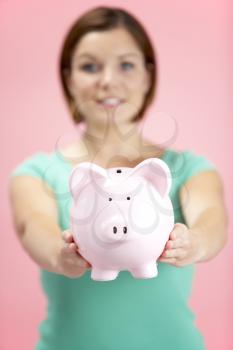 Royalty Free Photo of a Woman Holding a Piggybank