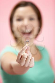Royalty Free Photo of a Woman Holding an Engagement Ring