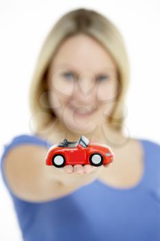 Royalty Free Photo of a Woman With a Toy Car