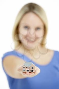 Royalty Free Photo of a Woman With a Model House
