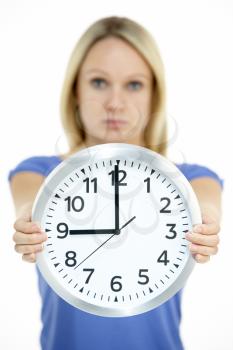 Royalty Free Photo of a Woman Showing a Clock