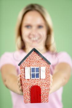 Royalty Free Photo of a Woman With a House
