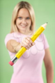Royalty Free Photo of a Woman With a Big Pencil