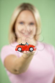 Royalty Free Photo of a Woman With a Toy Car