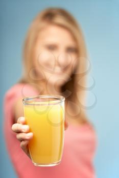 Royalty Free Photo of a Teenager With a Glass of Juice