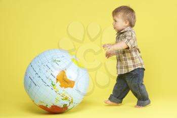 Royalty Free Photo of a Toddler With a Globe