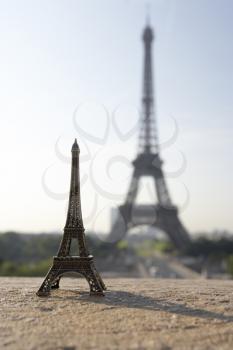 Royalty Free Photo of the Eiffel Tower and a Model of it in the Foreground